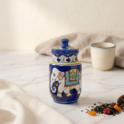 Artisan Jaipur Blue Pottery storage jar with lid designed with royal elephant motif, styled as a countertop ceramic canister