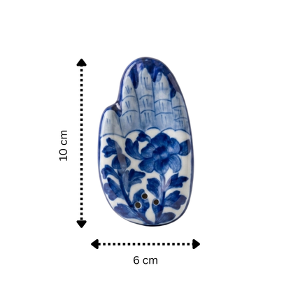 Blue Pottery hand-shaped agarbatti holder size reference — 10cm length, cobalt and white floral design