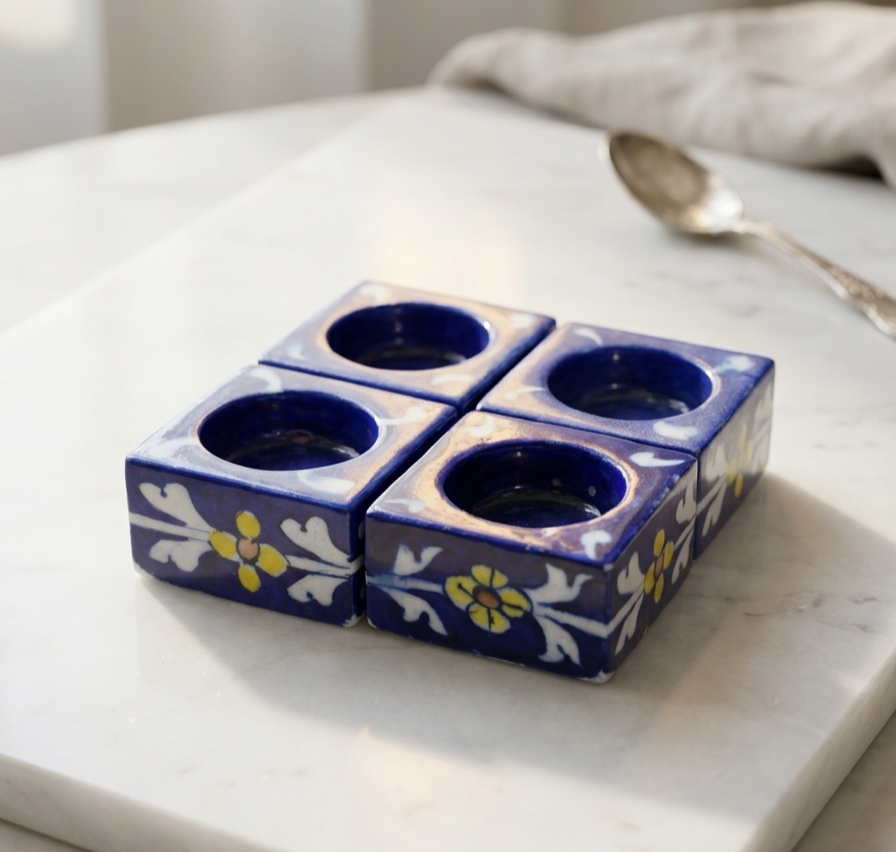Complete set of handcrafted Jaipur Blue Pottery candle holders featuring traditional Rajasthani floral artwork