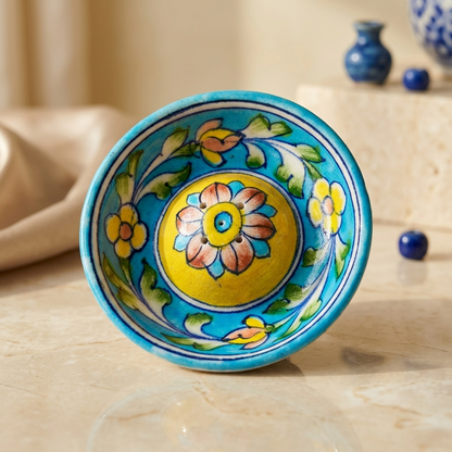 Handcrafted Blue Pottery incense holder with turquoise rim and hand-painted daisy and leaf vine pattern