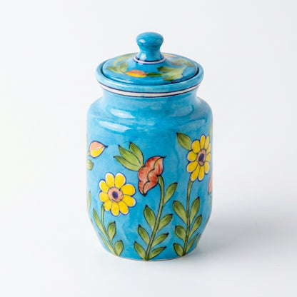 Full product view of a Jaipur Blue Pottery jar — sky-blue glaze, yellow sunflower and pink floral motif