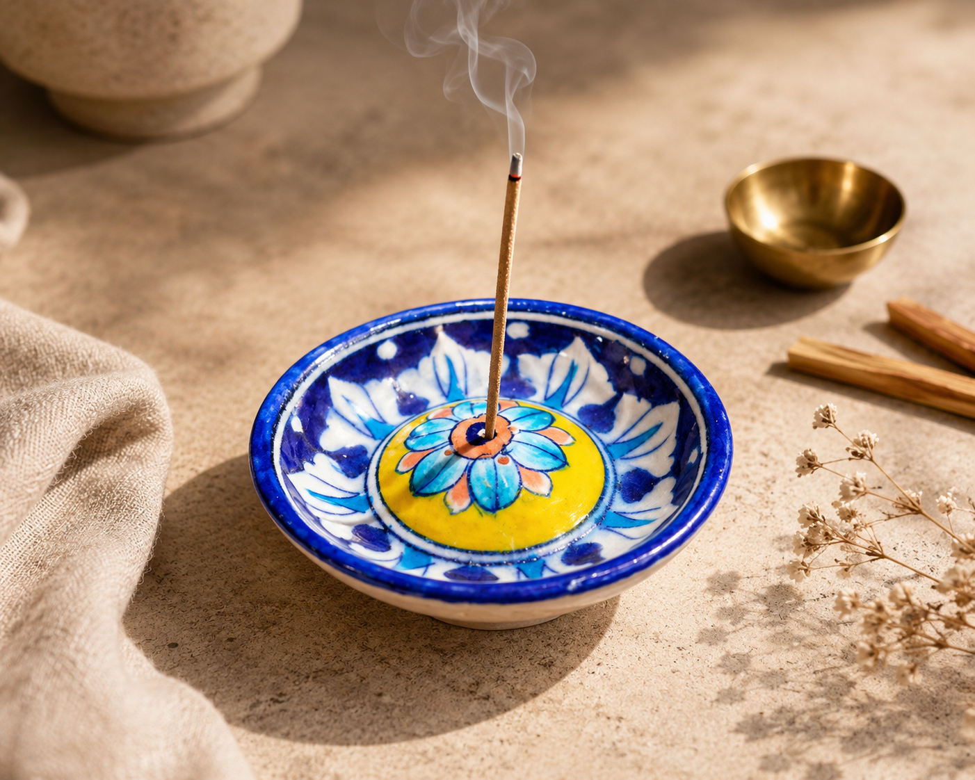 Jaipur Blue Pottery agarbatti holder in use with a lit incense stick, smoke rising, traditional pooja décor