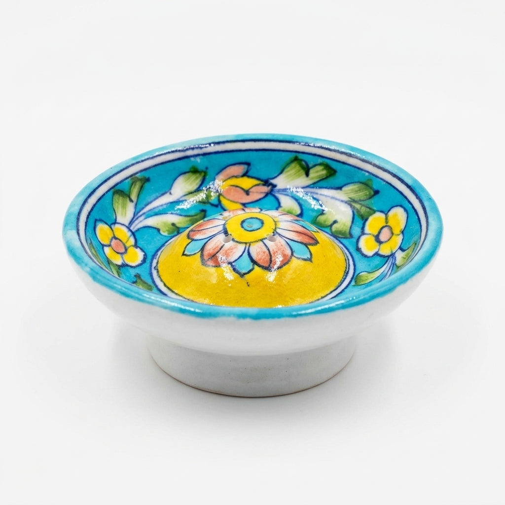 Rajasthani Blue Pottery incense holder with light turquoise glaze, yellow dome, and botanical vine design