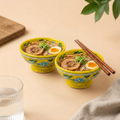 Set of two yellow handpainted Jaipur Blue Pottery bowls filled with noodles, showcasing traditional floral artwork for everyday dining