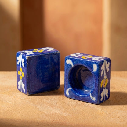 Two handcrafted Jaipur Blue Pottery candle holders with traditional floral designs in premium glazed ceramic